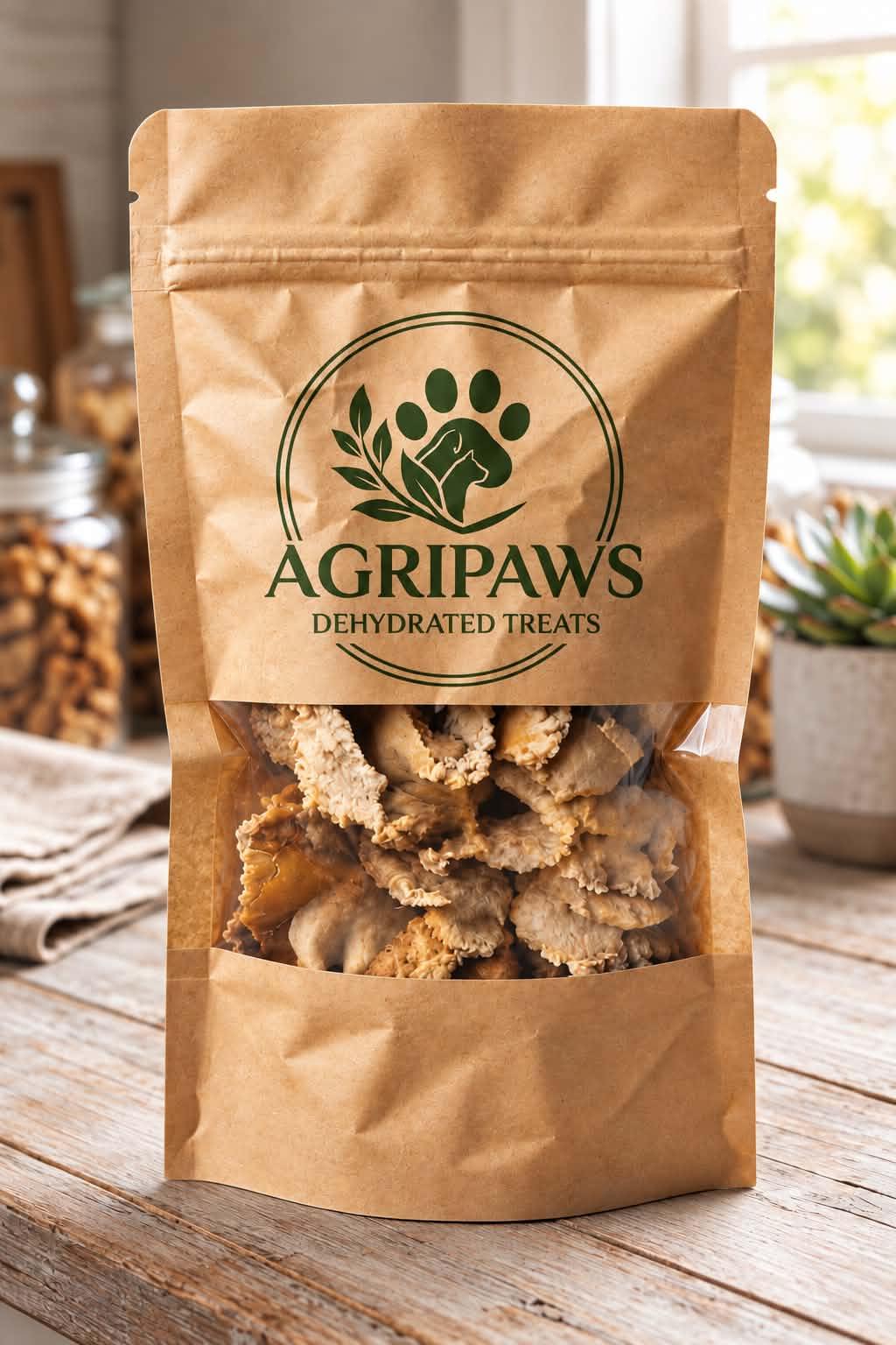 A kraft pouch of AgriPaws Dehydrated Treats with a clear window showing the treats inside